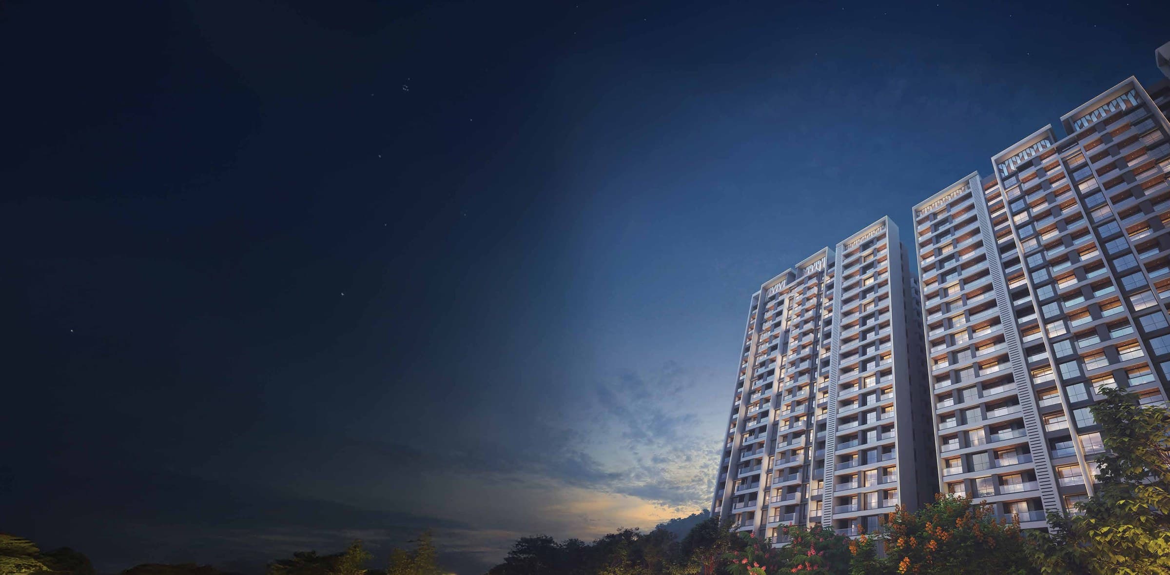 Kohinoor Woodshire, Bhugaon — multi-tower elevation at dusk with hills backdrop