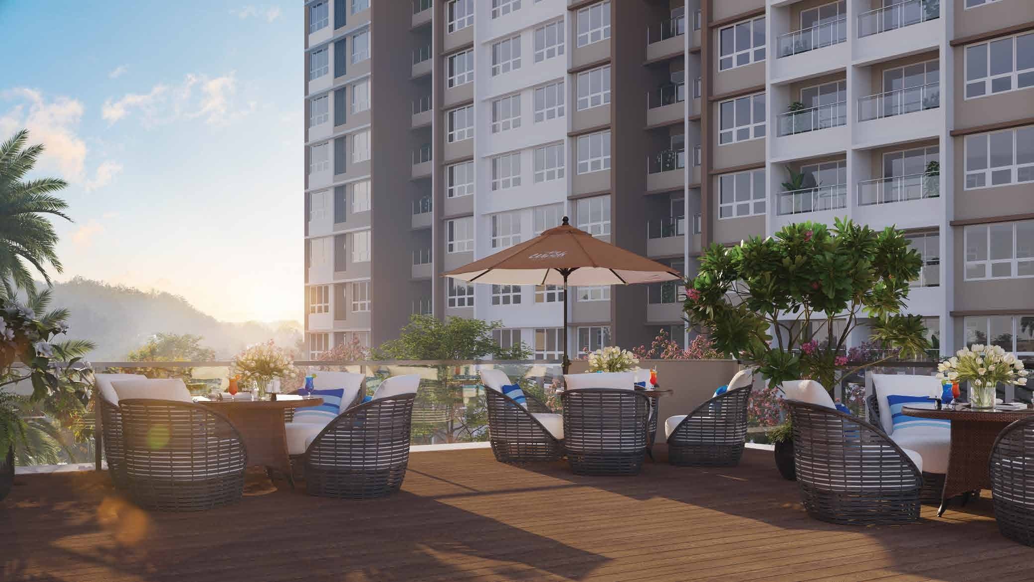 The Winds by Kolte Patil, Bhugaon — outdoor cafe terrace with sunrise hill views